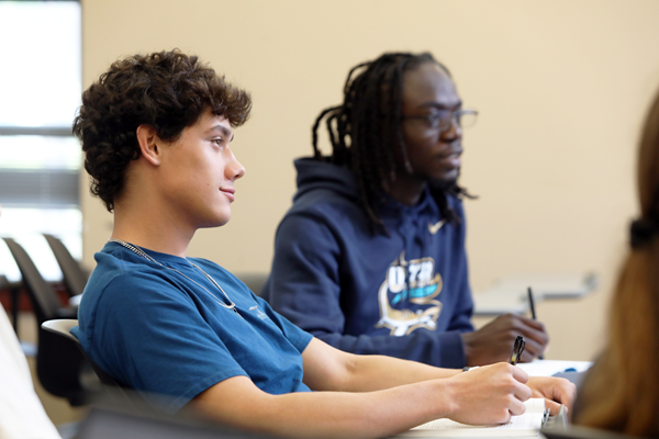 Two students at classroom desks Two students at classroom desks