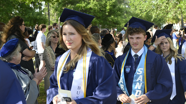 Graduation Students walking Graduation Students walking