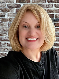 Sarah Brooks A woman in a black dress