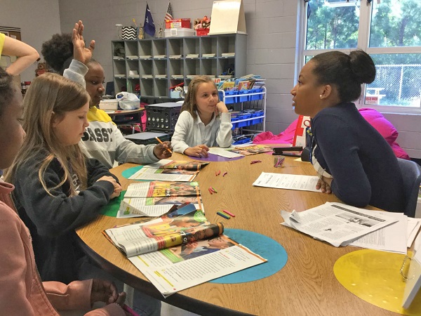 Kids working together at classroom table