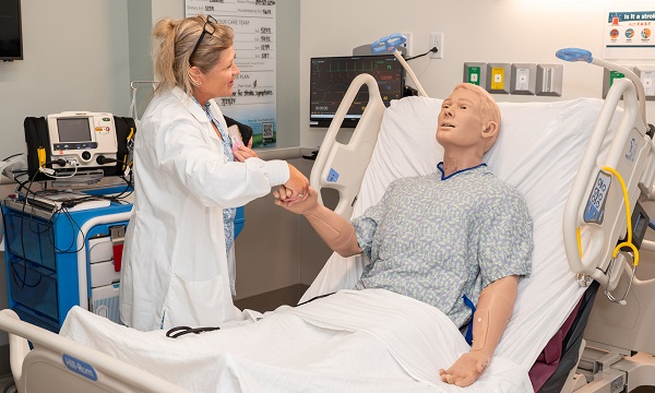 Nurse faculty with manikin