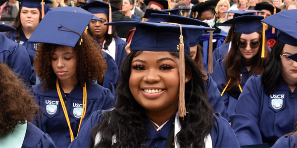 A smiling female graduate A smiling female graduate
