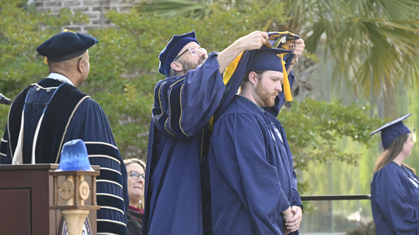 Department chair awarding student Department chair awarding student