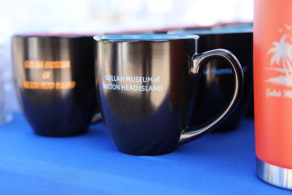 Orange and Blue coffee mugs for sale at the 2024 Gullah Food Festival 