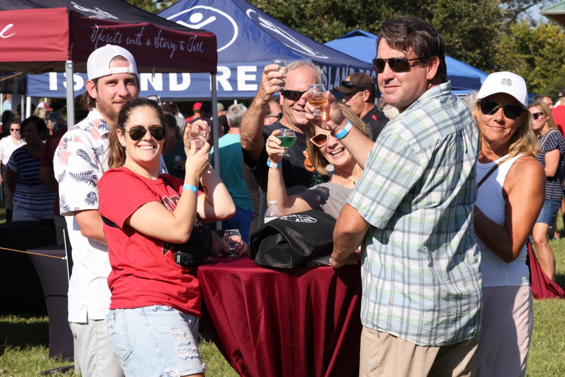 A group of people having a drink at the 2024 Rhythm and Brews Festival