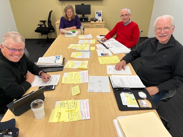 Facilitators working around a table