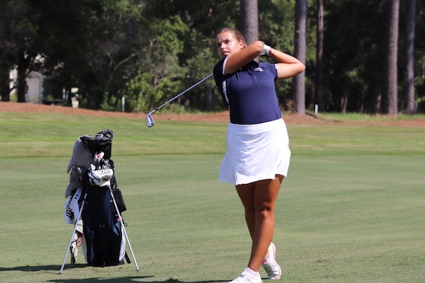 Woman playing Golf