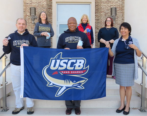 (Left to right, front row) Dr. Bud Sanders, Chancellor Al M. Panu, Dr. Juanita Babet Villena-Alvarez  (Back row) Dr. Cindy Lahar, Dr. Lynn McGee and Dr. Kimberly Cavanagh