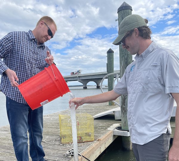 Dr. Tye Pettay,  assistant professor of Biological Oceanography at USCB and Chris Kehrer of the Port Royal Sound Foundation, measure turbidity in the Chechessee River.