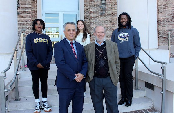 Beaufort County School District Superintendent Dr. Frank Rodriguez (left) and Dr. Bruce Marlowe, Chair of USCB’s Department of Education, are pictured here with Education majors (left to right) Jaire Brown, Kayla Townsend and Eugene McClaurin.