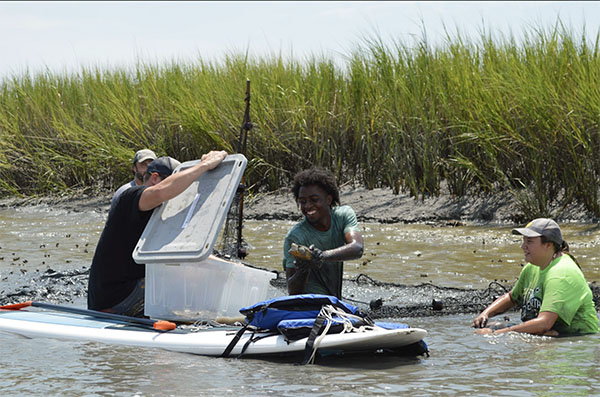 Jake Zadik - back left John Alexander - paddle board, Coastal Expeditions Ty Tobias - Clemson, MS student Katalaya Brandenburg - Fripp Intern